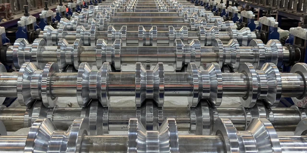Premium EN-31 hardened steel forming rollers with 30-35 micron hard chrome coating — CNC precision machined for HI-RIB profile accuracy CNC Machined EN-31 Steel Rollers for HI-RIB Roll Forming Machine